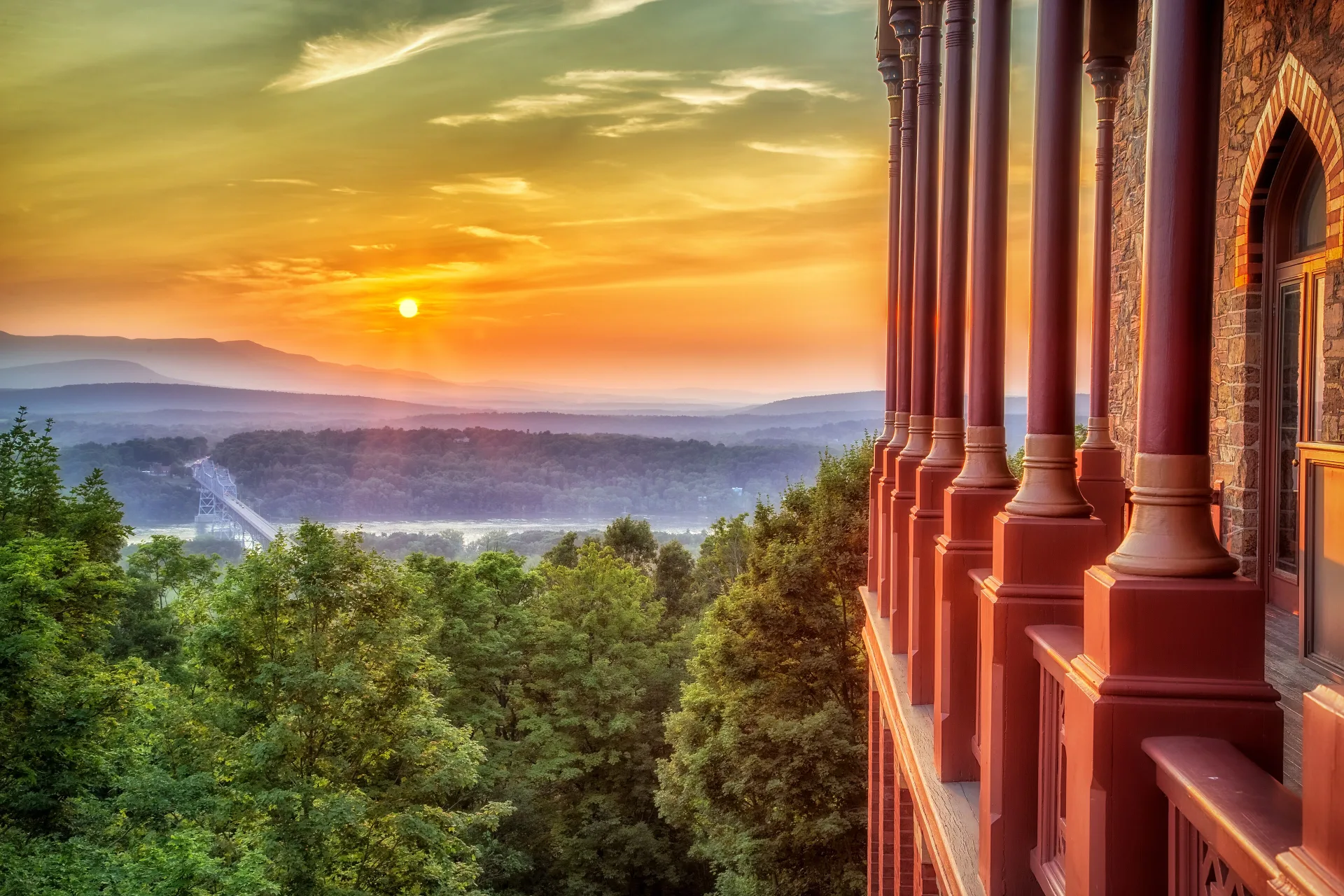 Sunset over the Hudson Valley framed by the Moorish columns of Olana's veranda