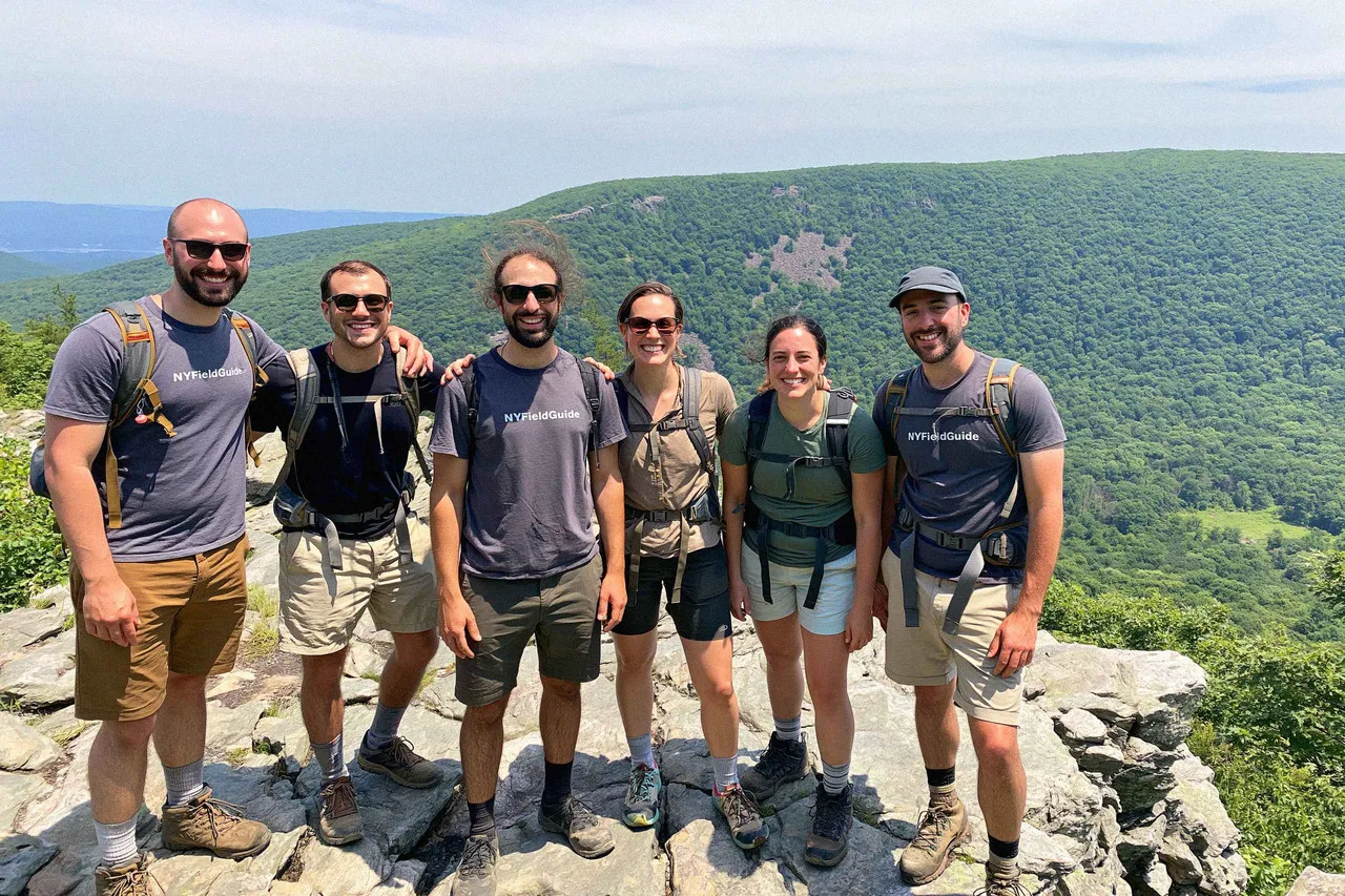 The six of us on a Catskills summit, forested ridges rolling out behind